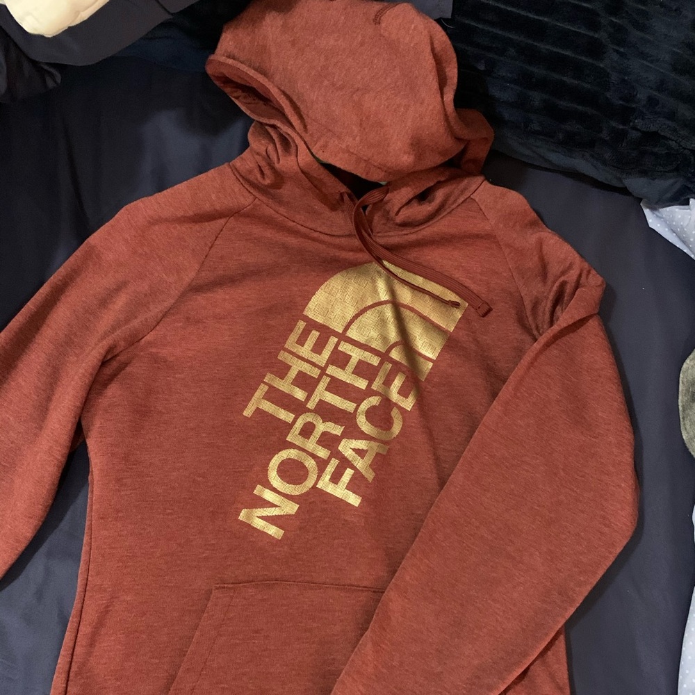 North face hoodie with gold lettering